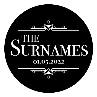 "The Surnames" text with "01.05.2022" underneath. Above and below this text is an art deco style pattern. All white on a black circle.