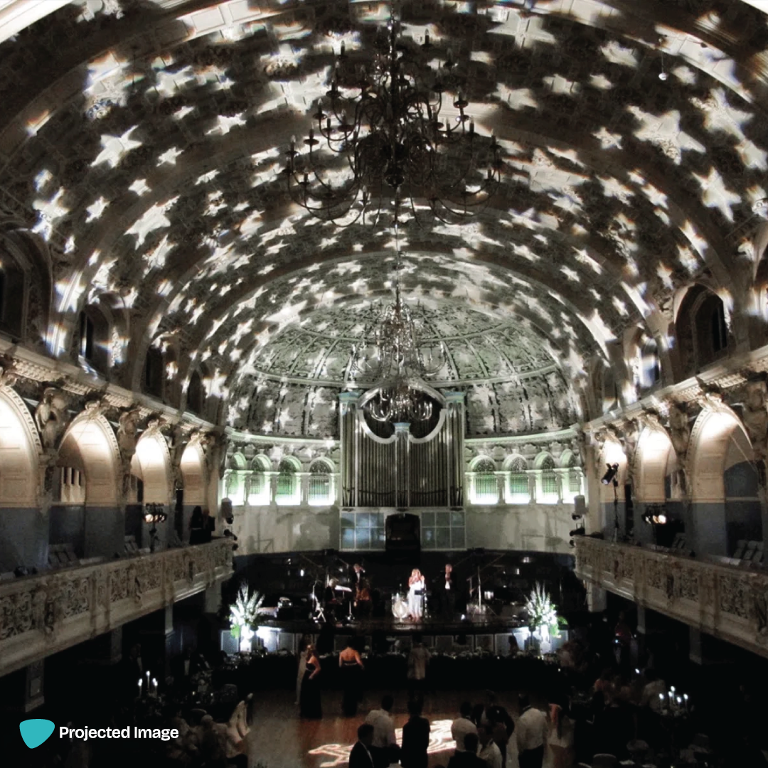 Star pattern projected on a venue ceiling using a gobo projector.