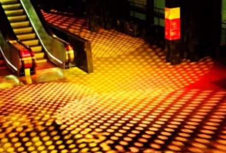 Large scale gobo projection in an art gallery, with patterned floor markings.