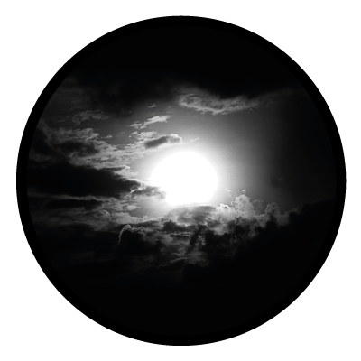 Greyscale image of a sun peeking through clouds on a black circle gobo.