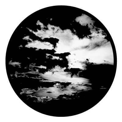 Greyscale image of clouds at sunset on a black circle gobo.