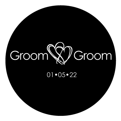 White "groom groom" text with 2 intertwined in between the two words.
Underneath this text is "01.05.22" in white. All on a black circle.