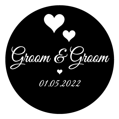 White "groom & groom" text with 2 white hearts above.
Underneath this is a small white heart and the text "01.05.22" in white. All on a black circle.