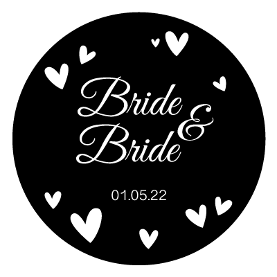 White stacked "bride & bride" text with white hearts surrounding. With white "01.05.22" underneath the text. All on a black circle.