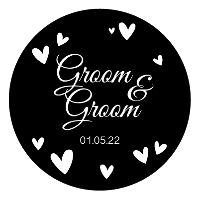 White stacked "groom & groom" text with white hearts surrounding. With white "01.05.22" underneath the text. All on a black circle.