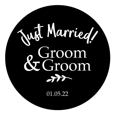 Curved "Just Married!" text with stacked "Groom & Groom". Underneath is a small leaf illustration and "01.05.22". All white on a black circle.