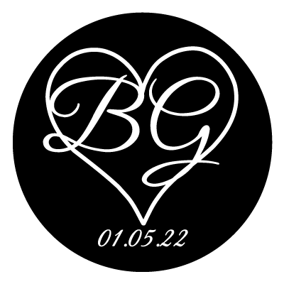 White heart outline with large "BG" in white inside the heart. Text below the heart is "01.05.22". All on a black circle.