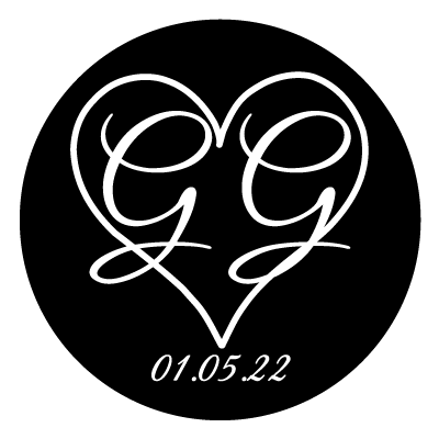 White heart outline with large "GG" in white inside the heart. Text below the heart is "01.05.22".  All on a black circle.