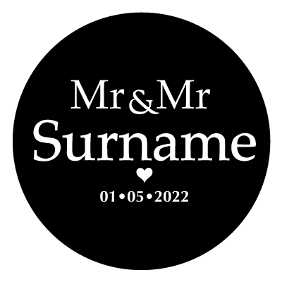 White "Mr & Mr Surname" text with a small white heart below. Underneath the small heart is the text "01.05.2022" in white. All on a black circle.
