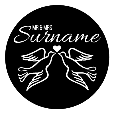 "Mr & Mrs Surname" text. Below this is a heart with an illustration on two doves facing each other. All white on a black circle.