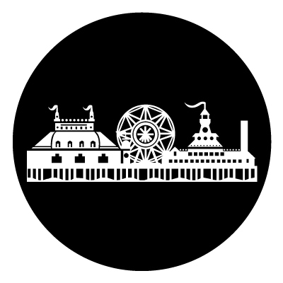 White silhouette of a seaside pier including a ferris wheel and circus tents on a black circle gobo.