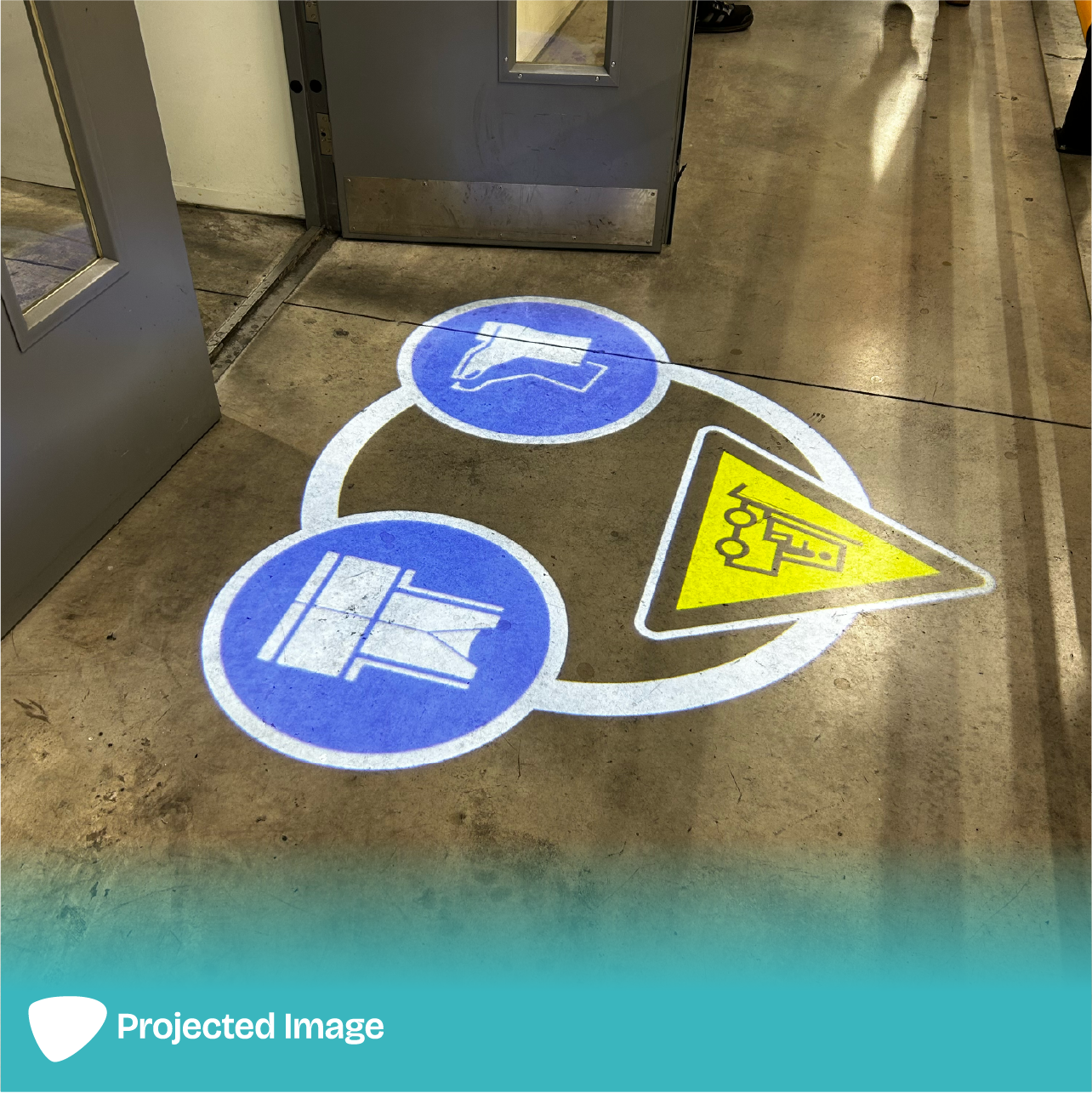 Projection of PPE and Forklift signage on a floor