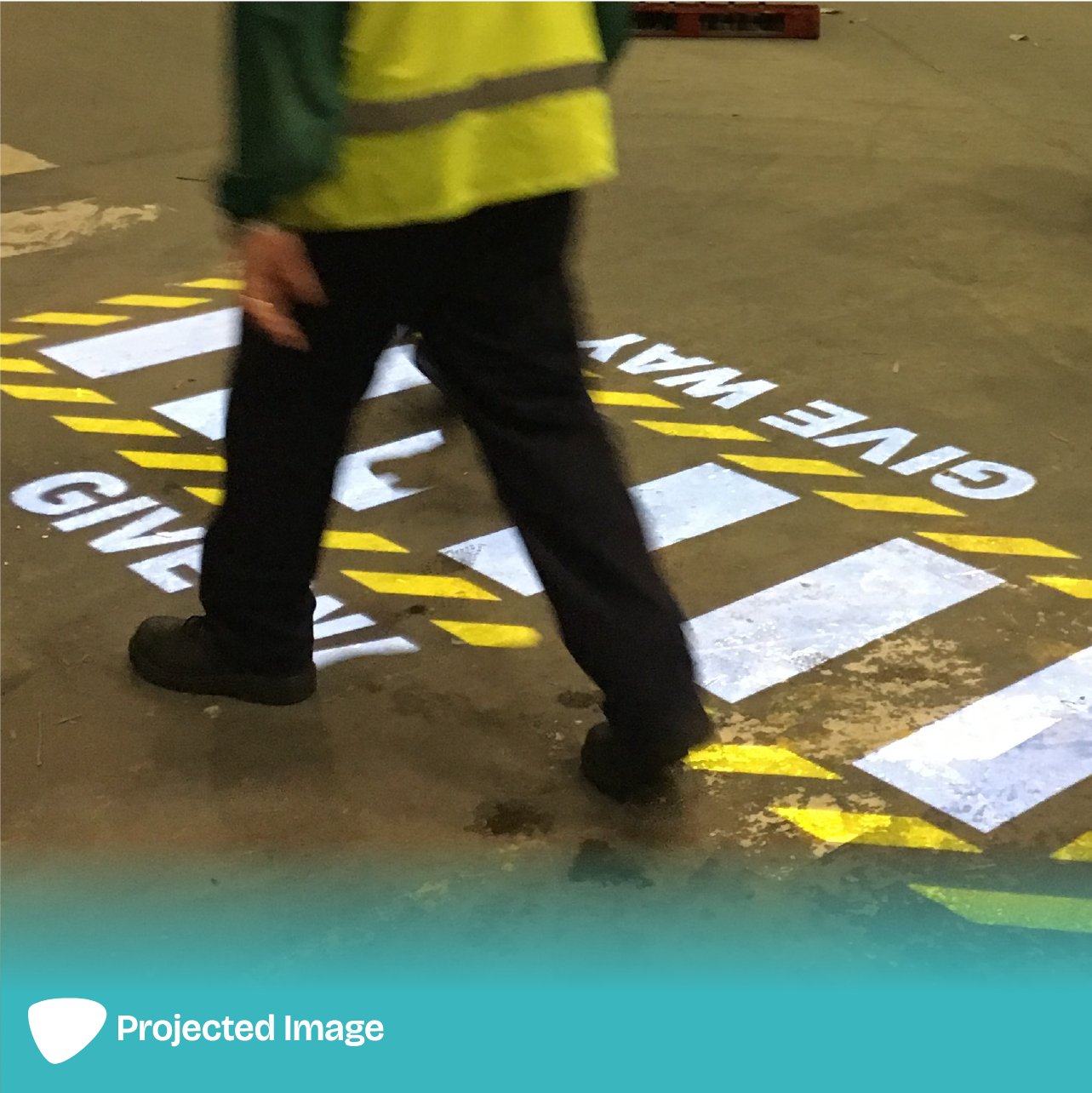 Projection of a 'Give Way' zebra crossing on a floor