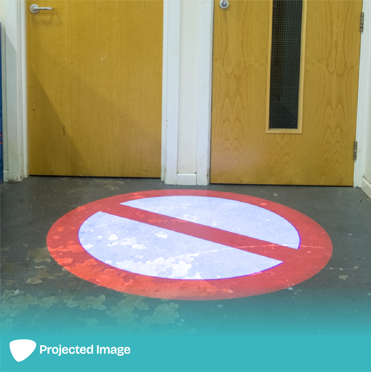 Projection of a 'No Entry' sign on a floor