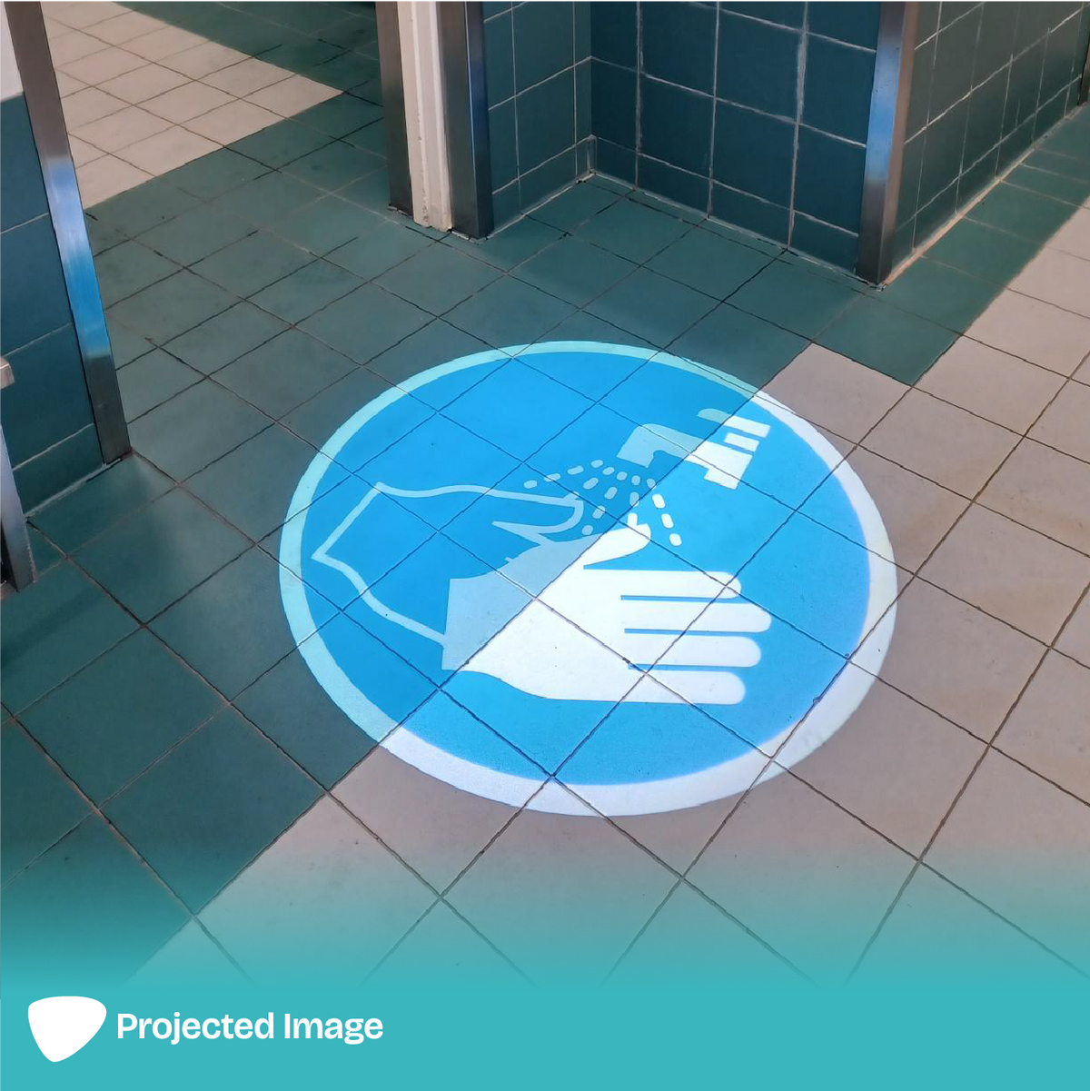 Projection of 'Hand Washing' signage on a floor