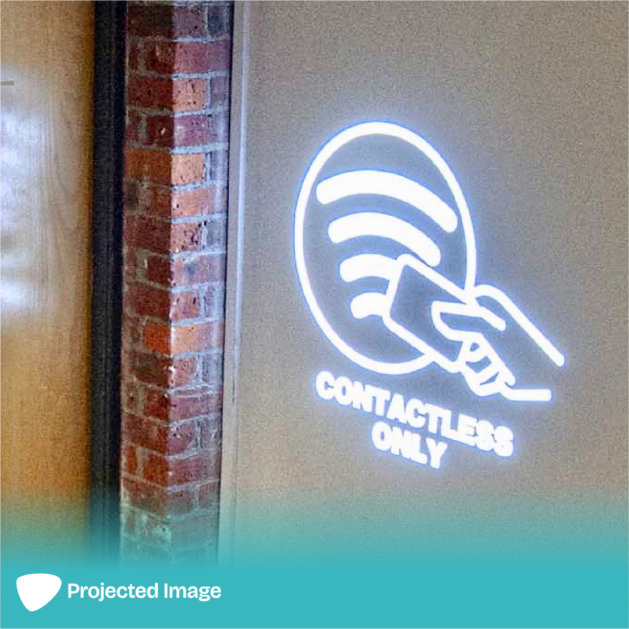 Projection of a 'Contactless Only' sign on a wall