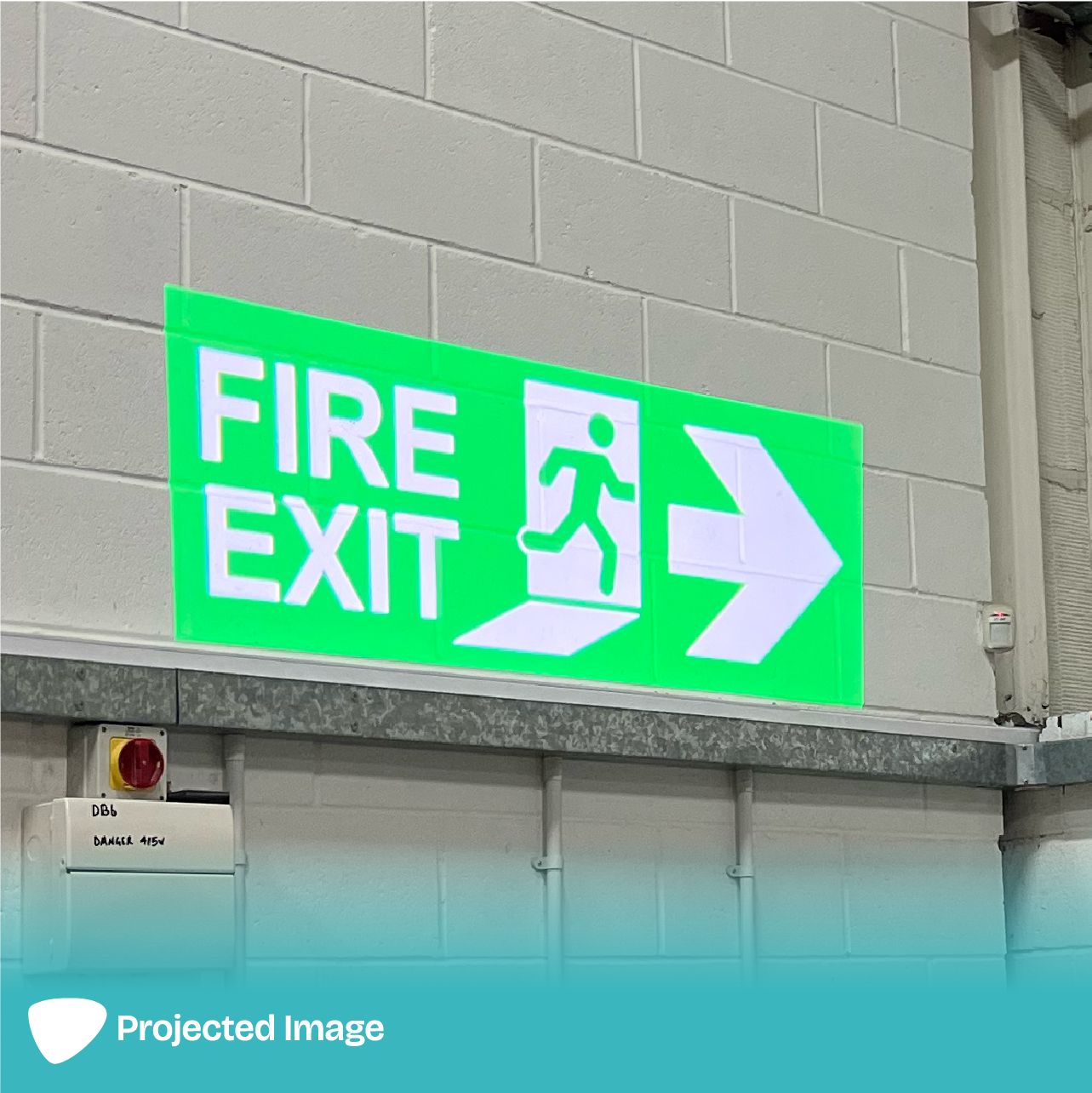Projection of a 'Fire Exit' sign on a wall