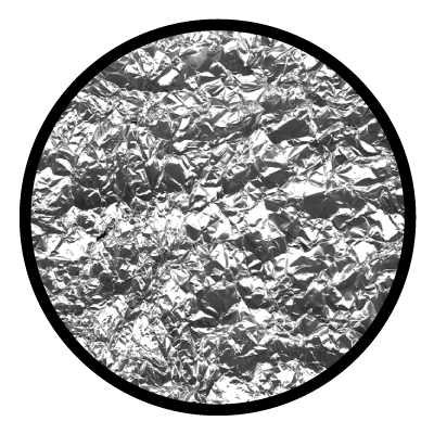 Greyscale image of a close up of scrunched up foil on a black circle gobo.