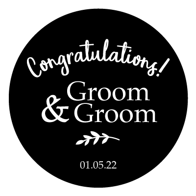 White curved "Congratulations!" text. Below this is stacked "Groom & Groom" text with a small leaf illustration and "01.05.22". All white on a black circle.