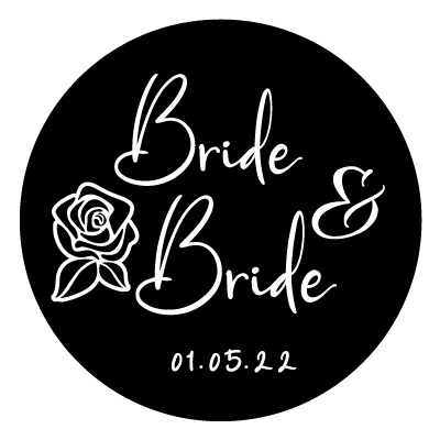 Stacked "Bride & Bride" text with a rose illustration to the left and "01.05.22". All white on a black circle.