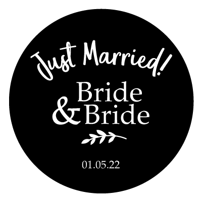 Curved "Just Married!" text with stacked "Bride & Bride". Underneath is a small leaf illustration and "01.05.22". All white on a black circle.