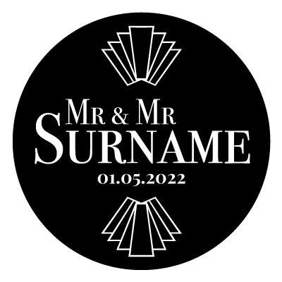 "Mr & Mr Surname" text with "01.05.2022" underneath. Above and below this text is an art deco style pattern. All white on a black circle.