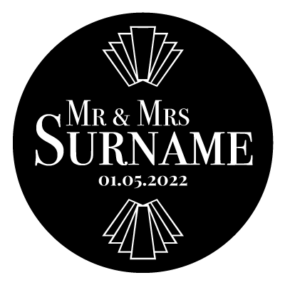 "Mr & Mrs Surname" text with "01.05.2022" underneath. Above and below this text is an art deco style pattern. All white on a black circle.