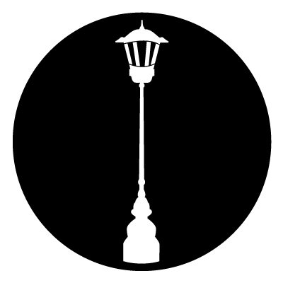 White silhouette of a lamp post on a black circle.